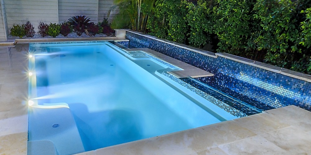 Concrete vs fibreglass pool - Vogue fibreglass pool installation with seating area